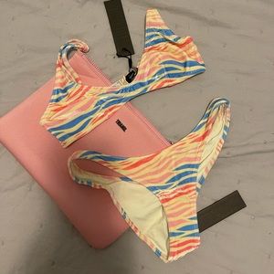 Brand new never worn triangle bathing suit with tags.